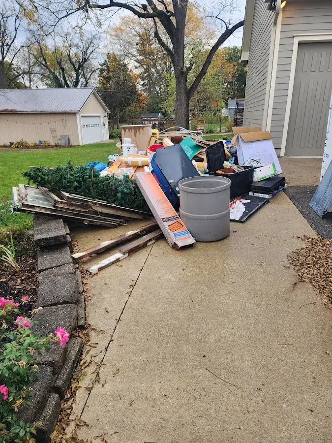 Dumpster being loaded with debris for Residential Dumpster Rental in Cherry Hill